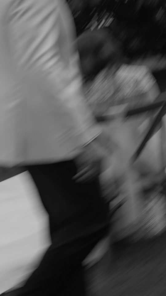 Black and white editorial wedding photograph of a couple