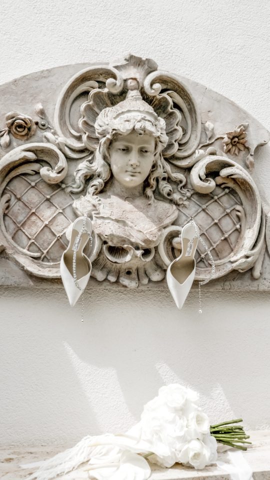 Editorial bridal bouquet beneath a wall sculpture